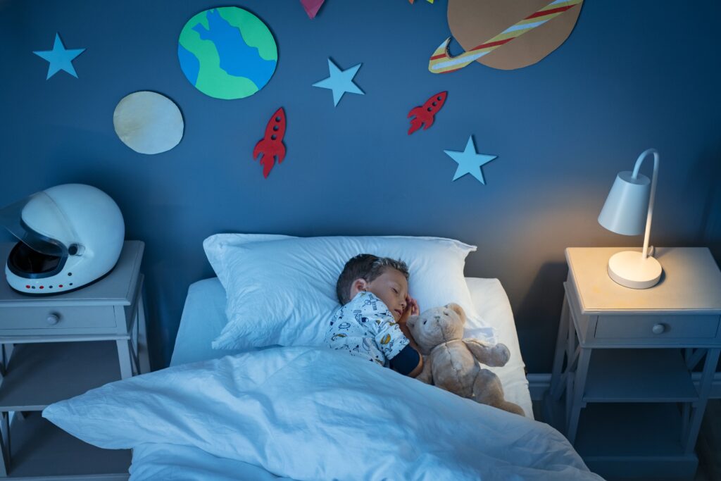 Boy sleeping and dreaming a future in the space